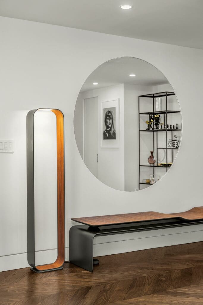 Luxury Home remodeled by nykb, image has round big mirror, luxury bench and lightning