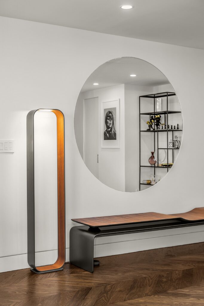 Luxury Home remodeled by nykb, image has round big mirror, luxury bench and lightning