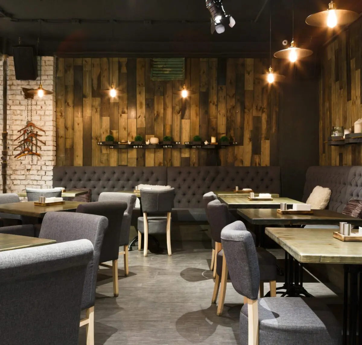 Cozy wooden interior of restaurant, copy space. Comfortable modern dining place, contemporary design background
