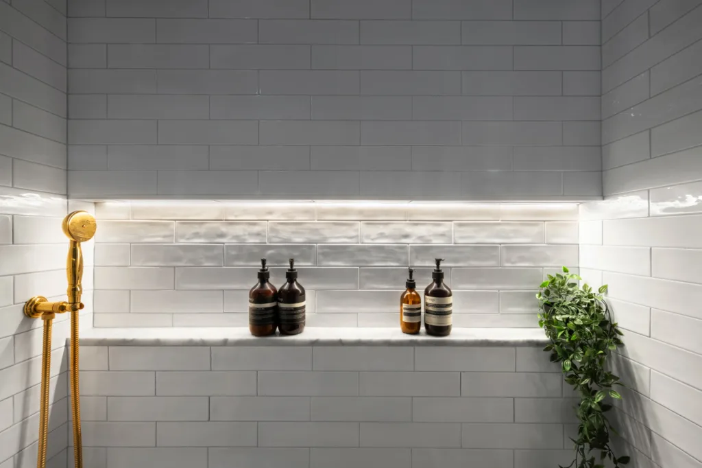 Small bathroom remodeling ideas by NYKB, white niche inside the shower